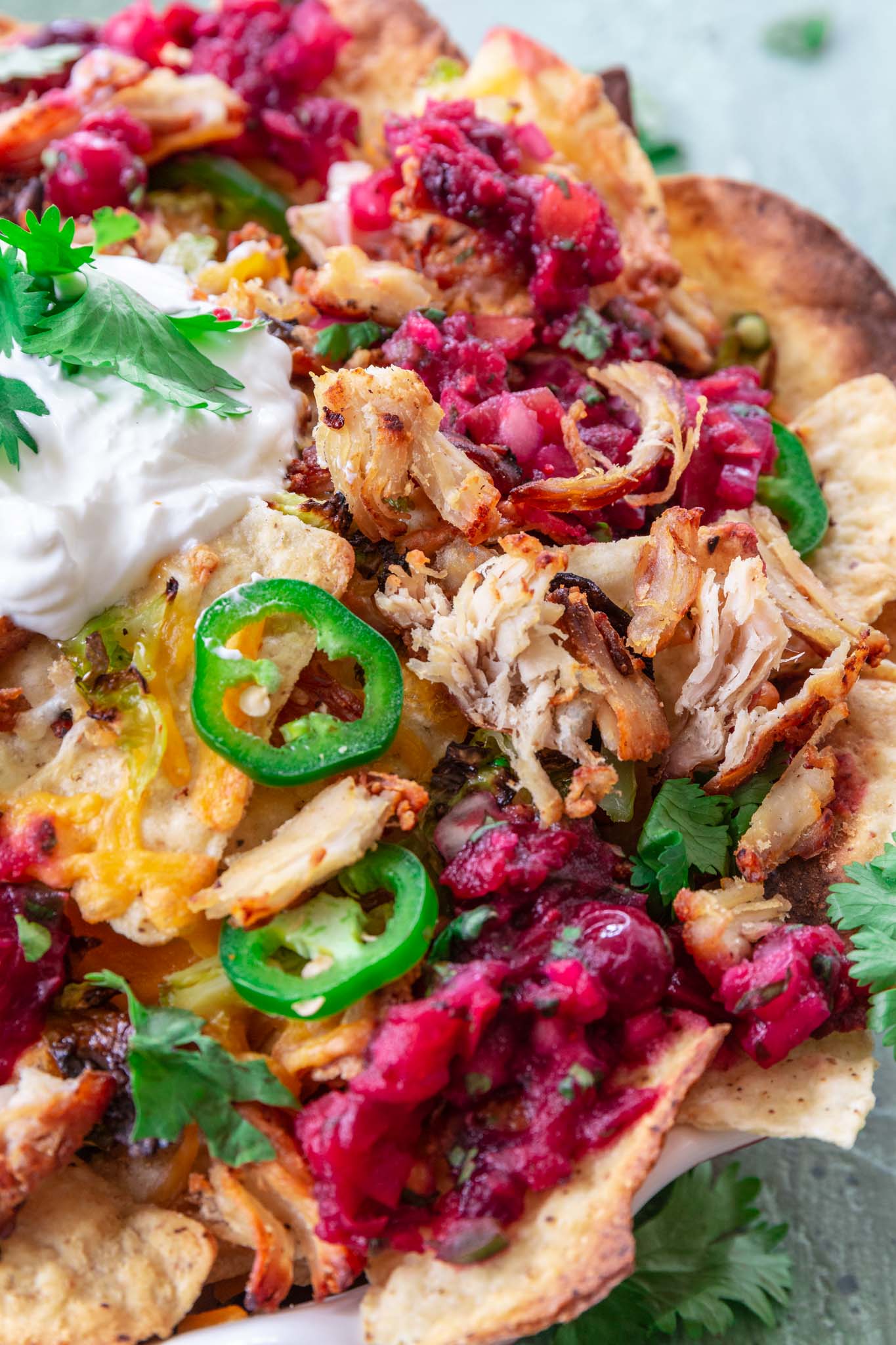 Thanksgiving Leftover Turkey Nachos | www.oliviascuisine.com | If you're looking for a way to use all that leftover turkey from Thanksgiving, these Leftover Turkey Nachos might be just what you need! Crispy Mission® Triangles Tortilla Chips topped with turkey carnitas, cranberry sauce salsa, Brussels sprouts and lots of cheese. Oh, it doesn't get better than that!
