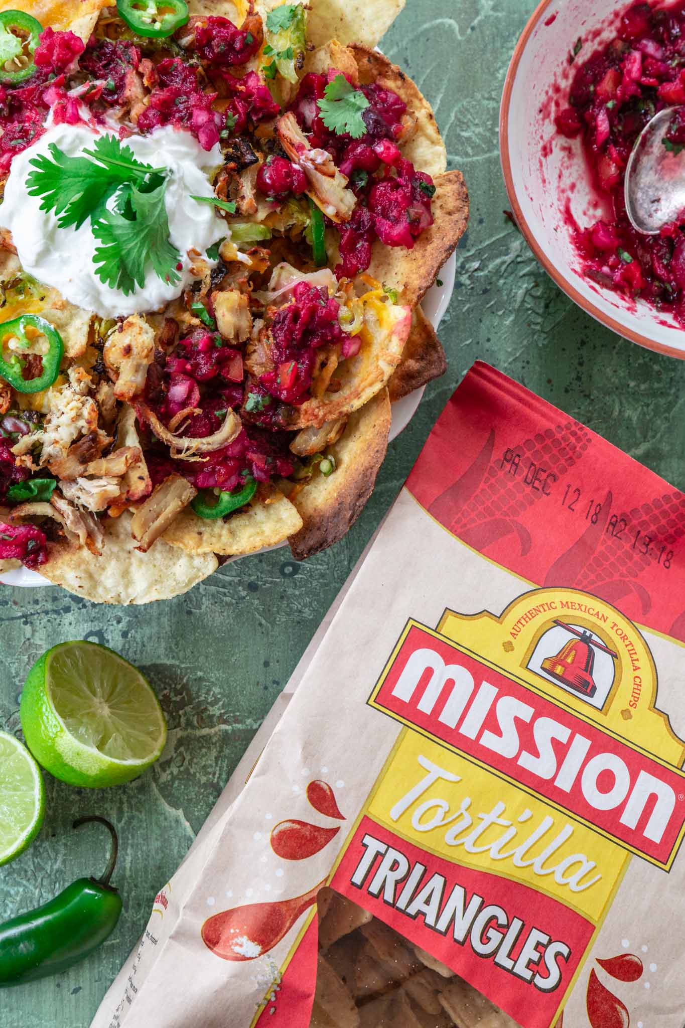 Thanksgiving Leftover Turkey Nachos | www.oliviascuisine.com | If you're looking for a way to use all that leftover turkey from Thanksgiving, these Leftover Turkey Nachos might be just what you need! Crispy Mission® Triangles Tortilla Chips topped with turkey carnitas, cranberry sauce salsa, Brussels sprouts and lots of cheese. Oh, it doesn't get better than that!