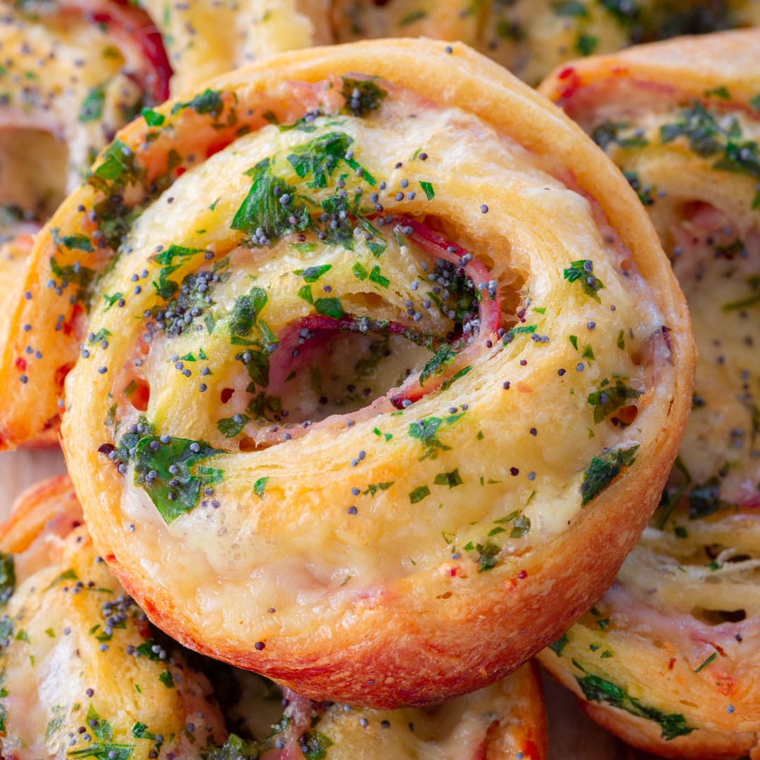 A close up of a ham and cheese pinwheel snack.