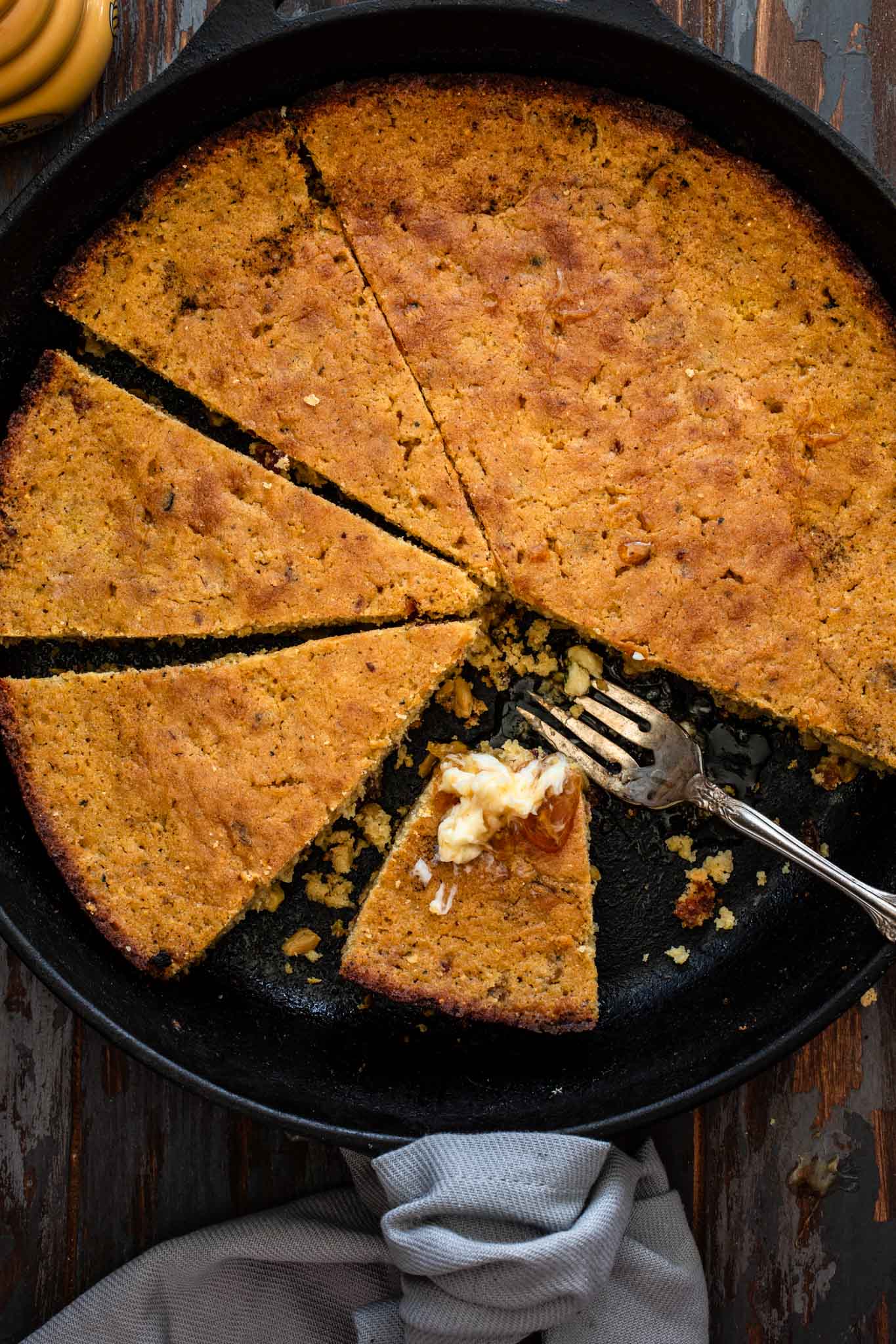 Sliced cornbread in a skillet