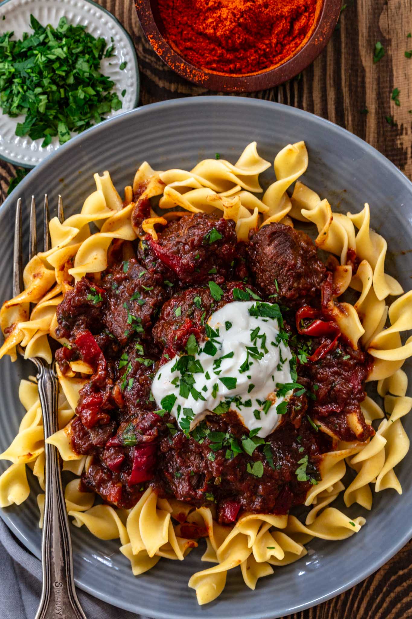 Beef stew over noodles