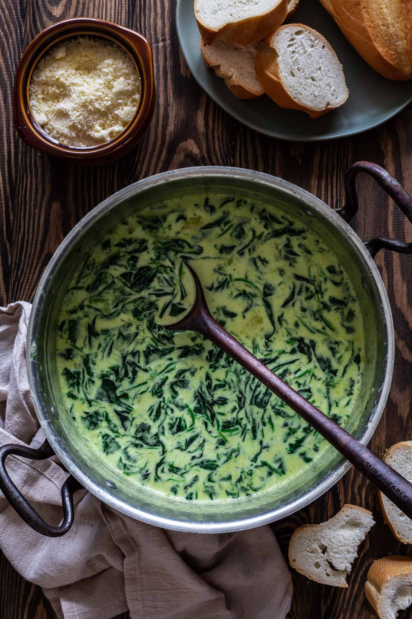 a pot of creamed spinach soup