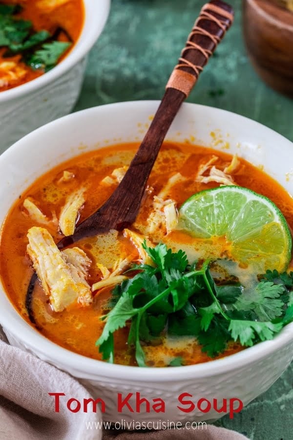 A closeup of a serving of Thai Coconut Chicken Soup (Tom Kha Gai Soup)