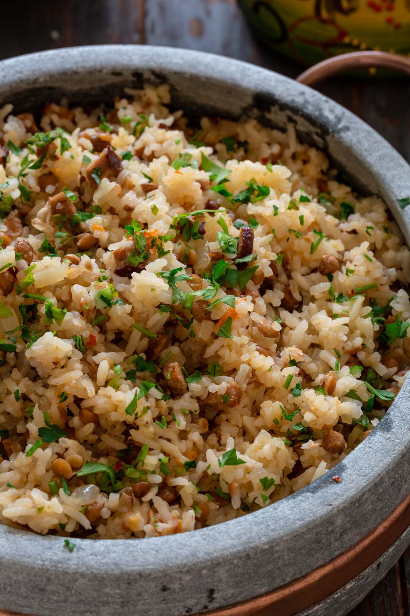 A close up photo of rice with chorizo and lentils.