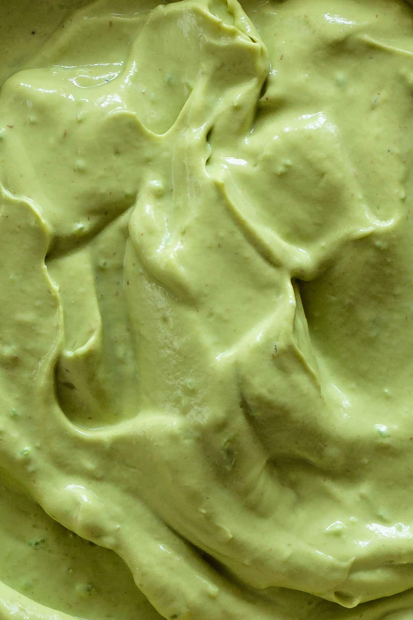 A close up of creamy whipped avocado.