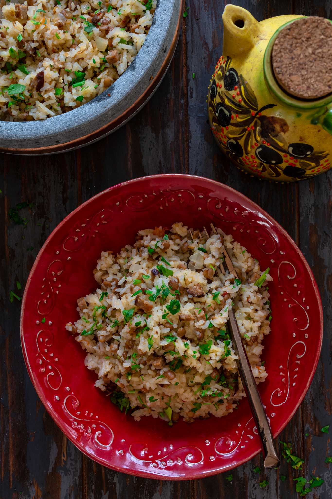 A plate of dirty rice with chorizo and lentils