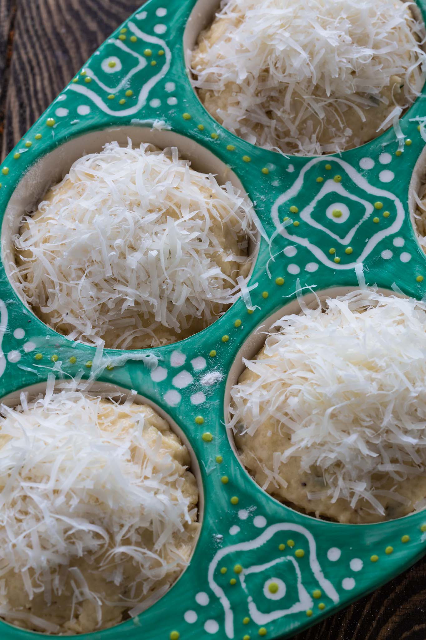 A tin of parmesan muffins before going to the oven.