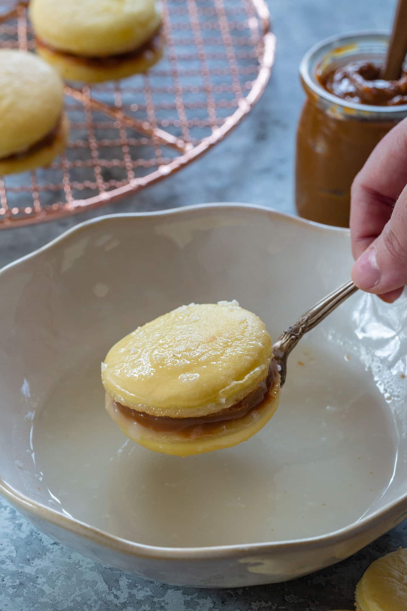 Dulce de leche cookies dipped in sugar glaze