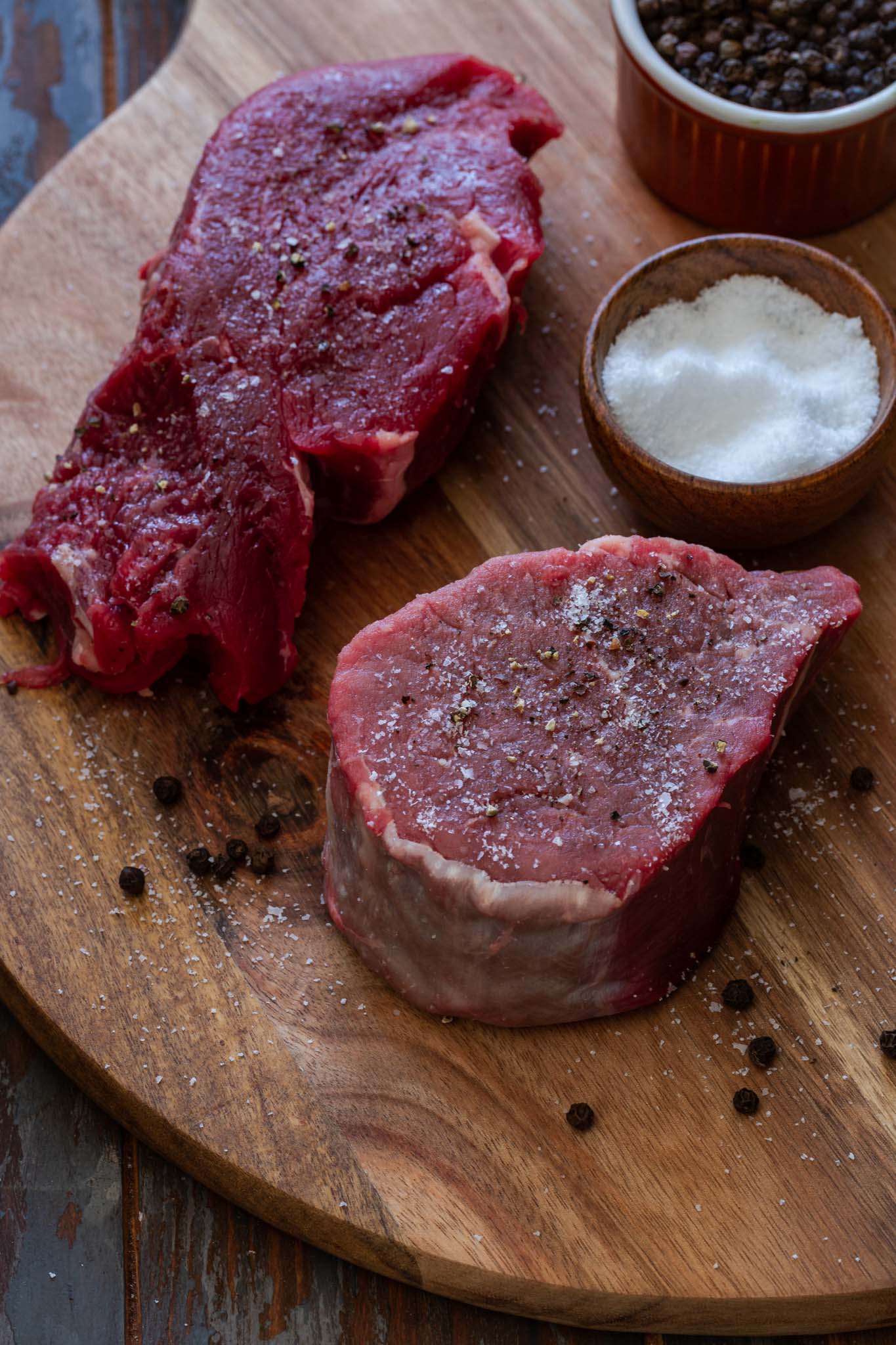 Tenderloin steaks seasoned with salt and pepper.