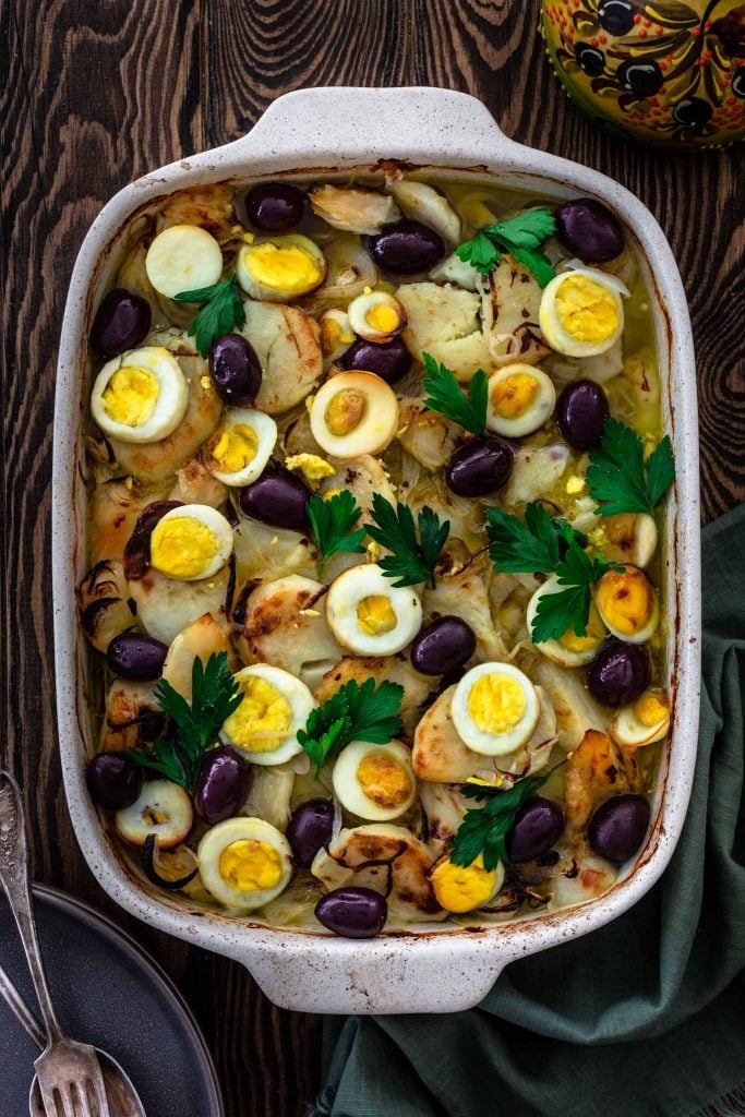 A dish of Bacalhau (Baked Cod Fish with Potatoes, Onions, Olives and Eggs).