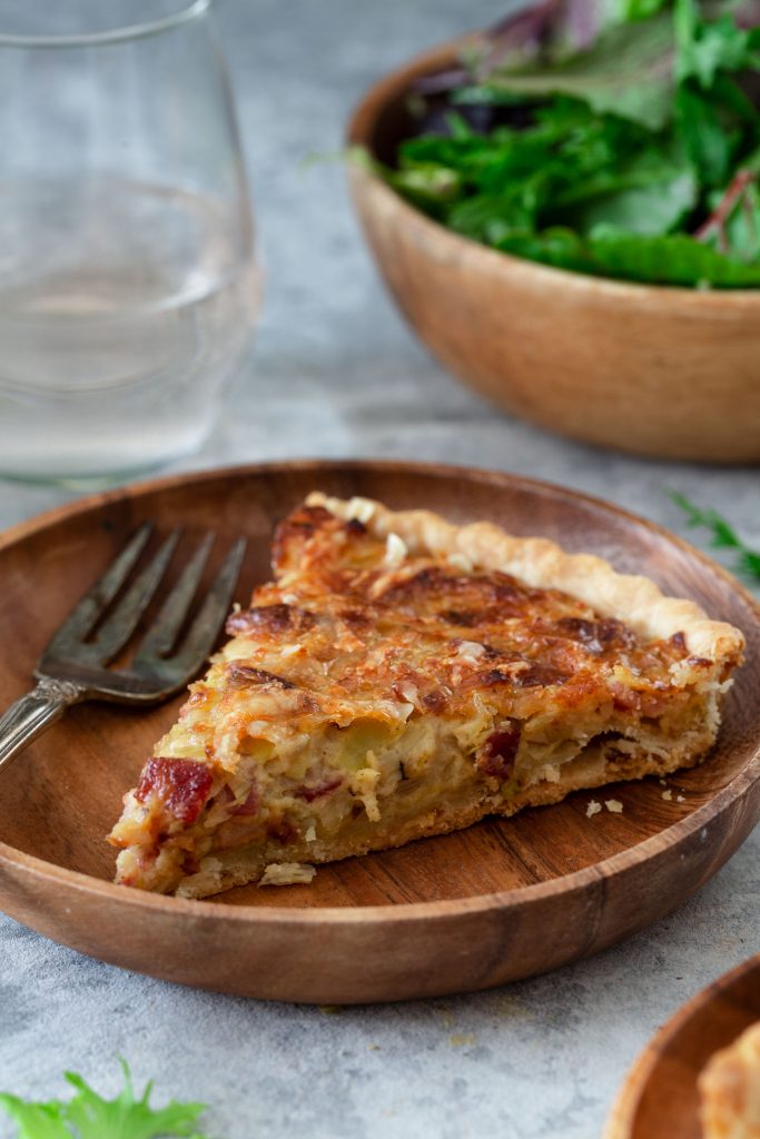 A slice of French Leek Tart, also known as Flamiche aux Poireaux.