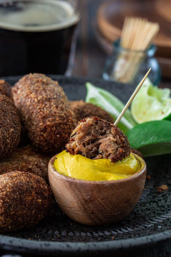 Oxtail croquettes served with yellow mustard