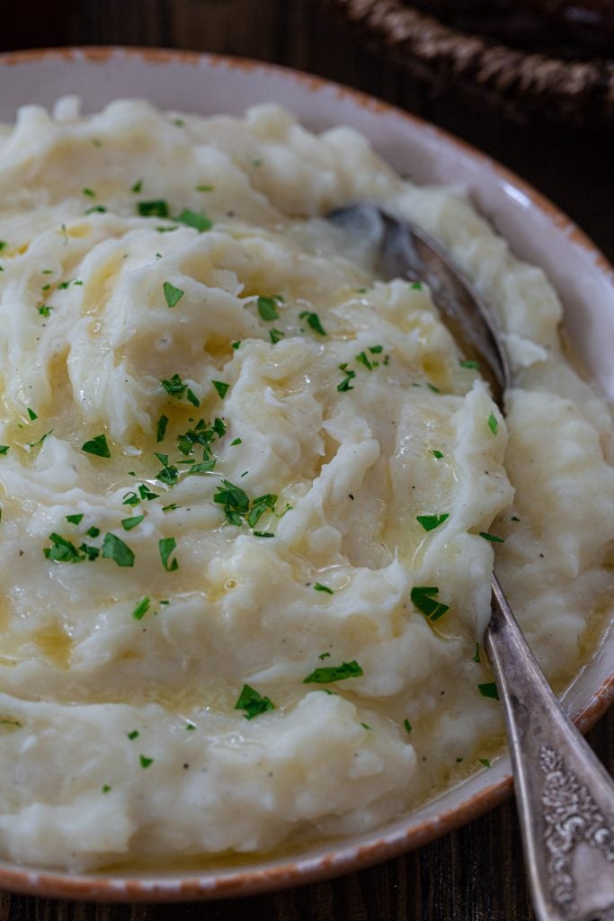 A close up of creamy mashed yuca.