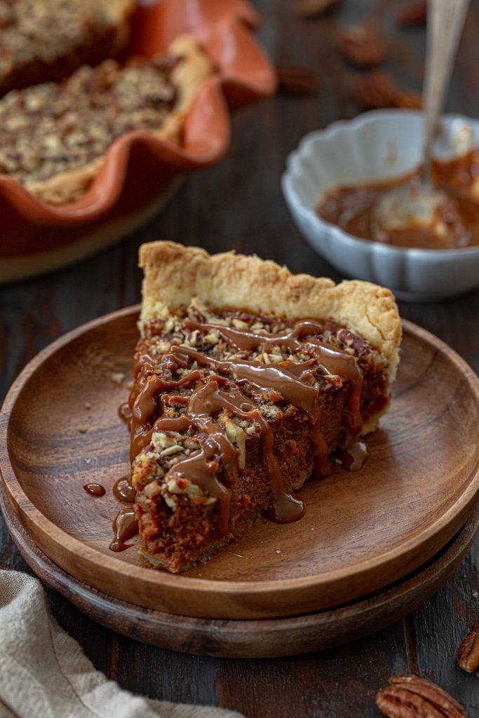 A slice of pecan pie made with dulce de leche.