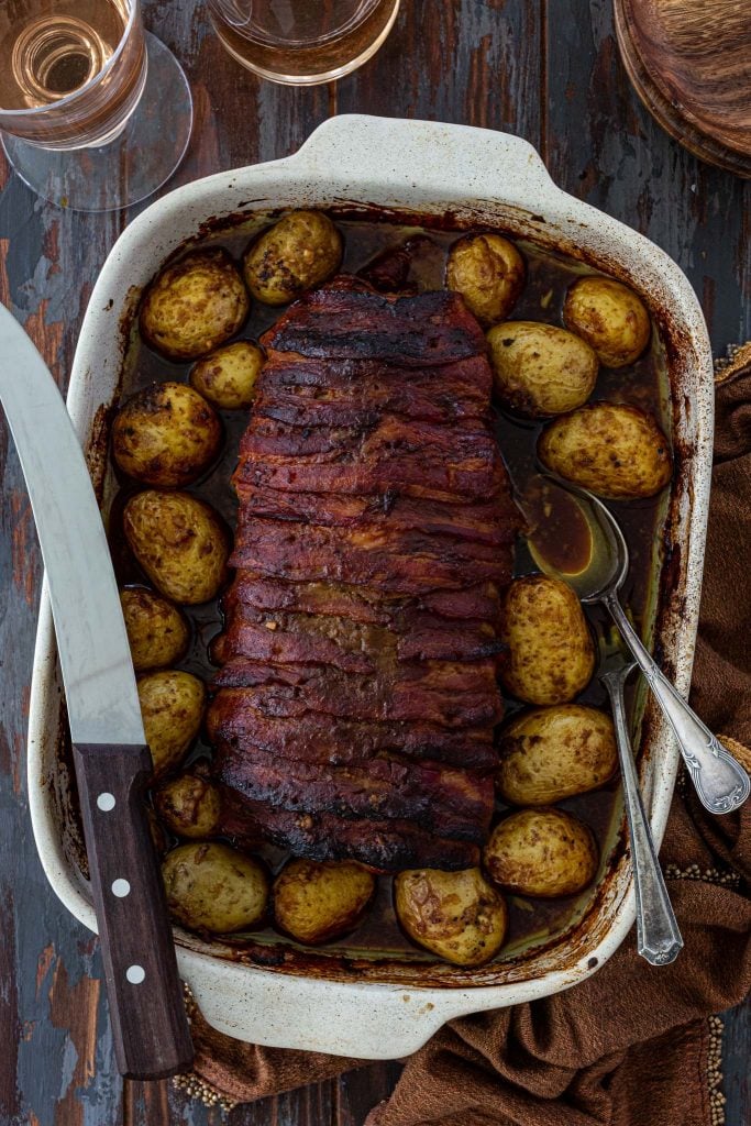 Bacon wrapped pork loin glazed with mustard and molasses.