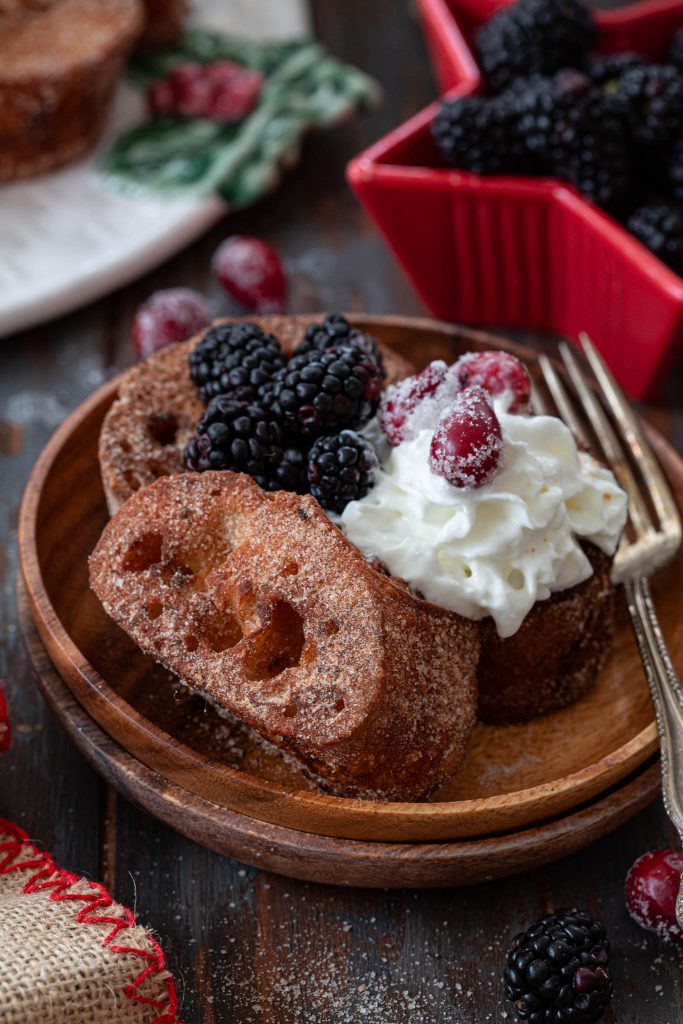 Brazilian French toast Rabanada served with whipped cream and berries.