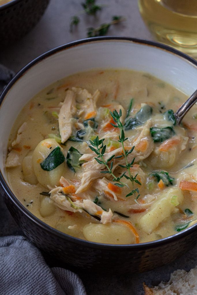 A soup made with shredded turkey, gnocchi, veggies and a creamy broth.