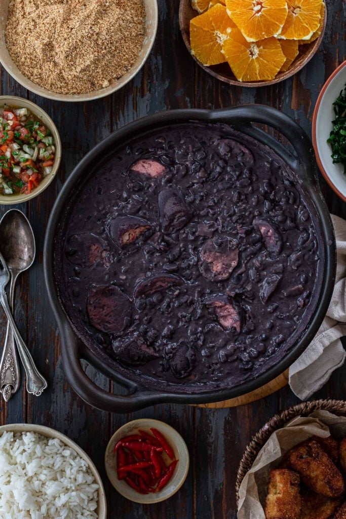 A big pot of feijoada with all the sides.