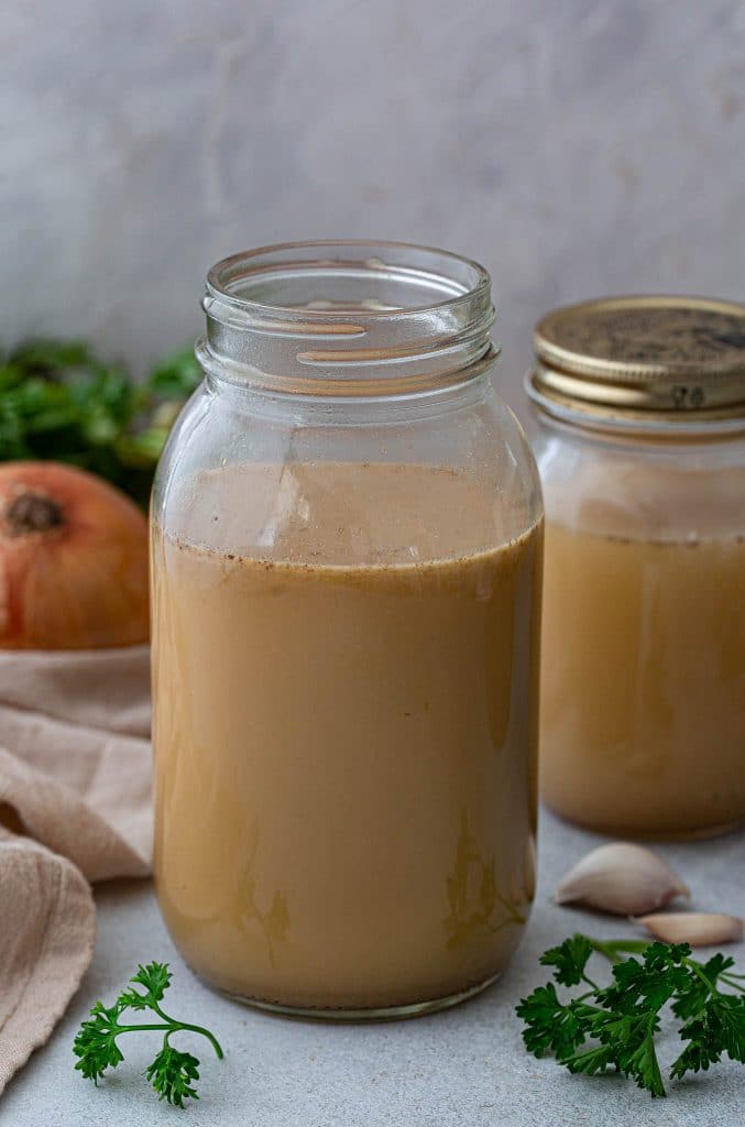 A jar of homemade chicken stock.