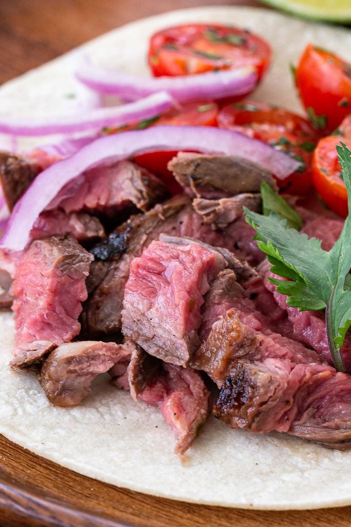 A close up shot of sliced flank steak.