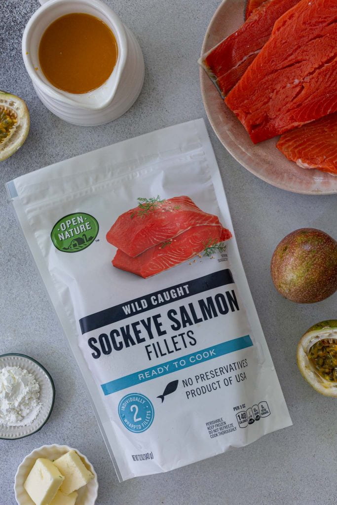 A photo of the package of the frozen sockeye salmon from Open Nature. You can also see salmon, passion fruit pulp, passion fruits, cornstarch and butter.