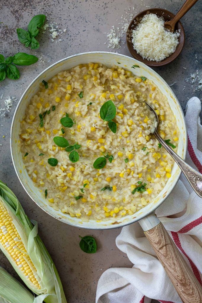 Sweet corn risotto in a pan.