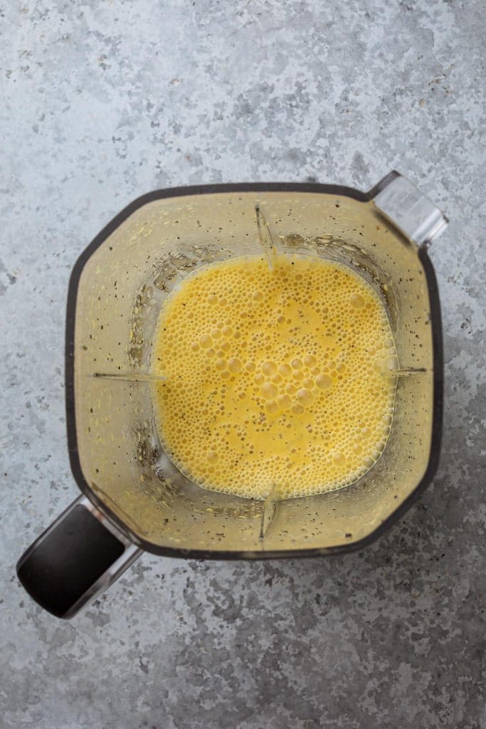 Passion fruit vinaigrette in a blender jar.