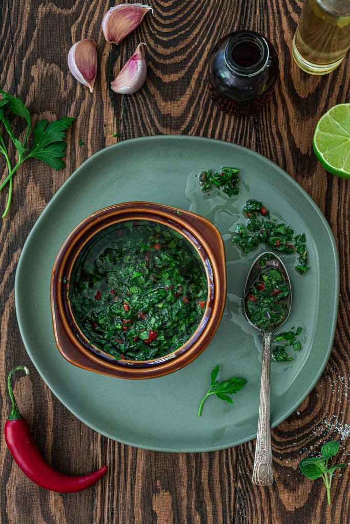 A flatlay overhead shot of Argentinian chimichurri sauce.