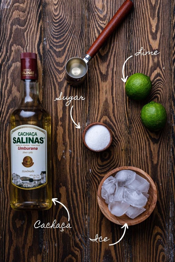 A photo of the ingredients: cachaça, ice, limes and sugar.