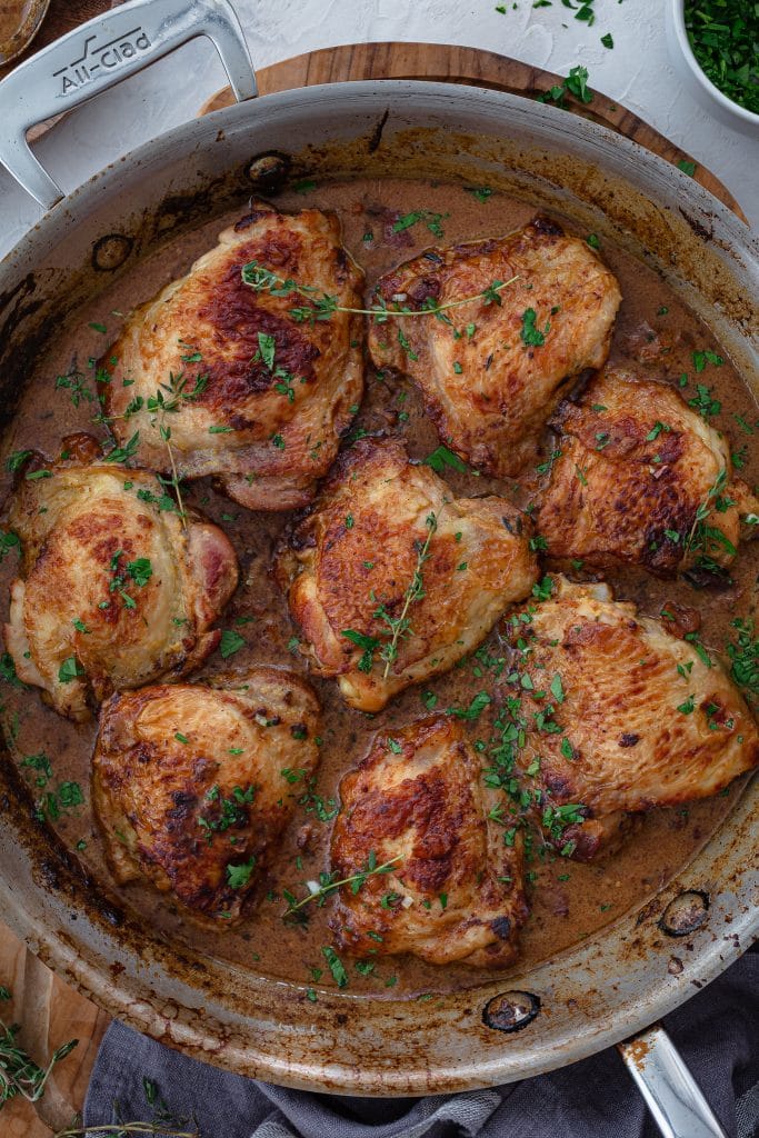 Chicken thighs braised in a mustard sauce.