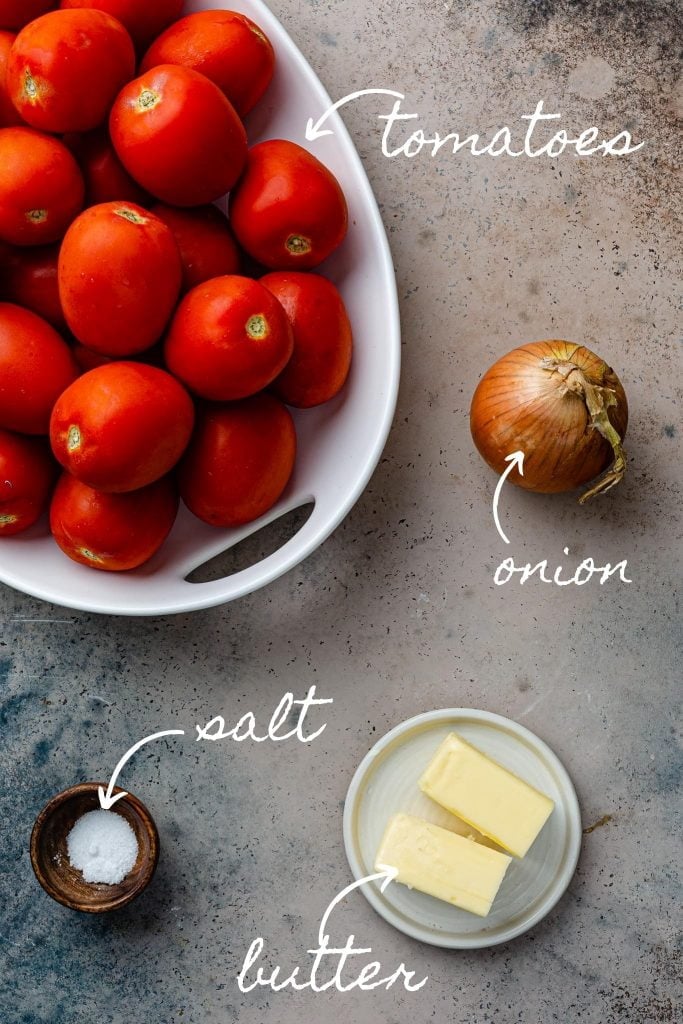 A photo of the ingredients: tomatoes, onion, butter and salt.