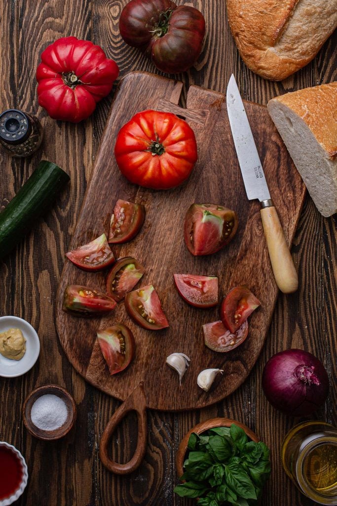 A photo of heirloom tomatoes on a cutting board.