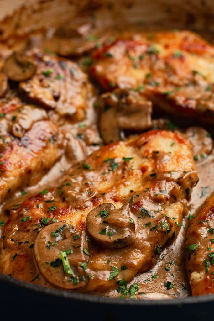 A close up shot of a chicken marsala cutlet.