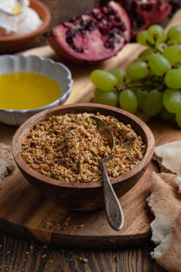 A bowl of dukkah as part of an appetizer board.