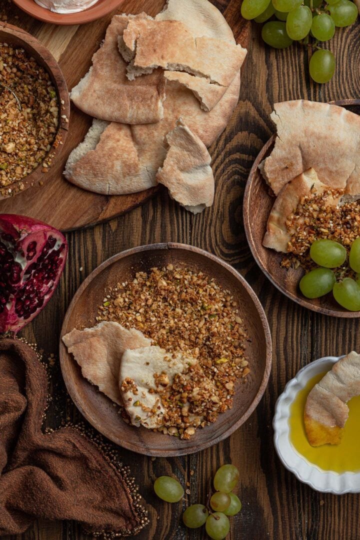 Dukkah served with pita bread, olive oil and fresh fruit.