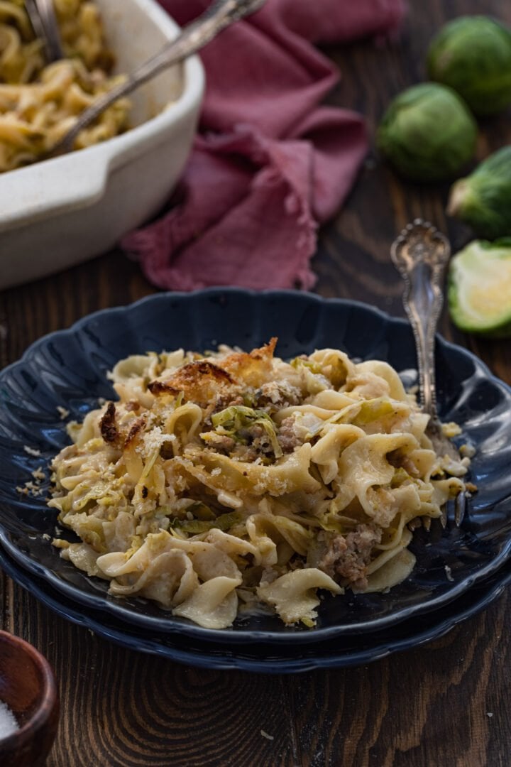 An individual portion of the sausage Brussels sprouts pasta bake.