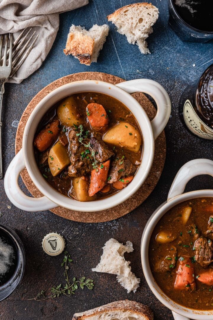 An overhead image of two bowls of Guinness beef stew.