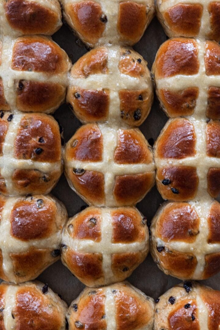 An overhead photo of a batch of hot cross buns.