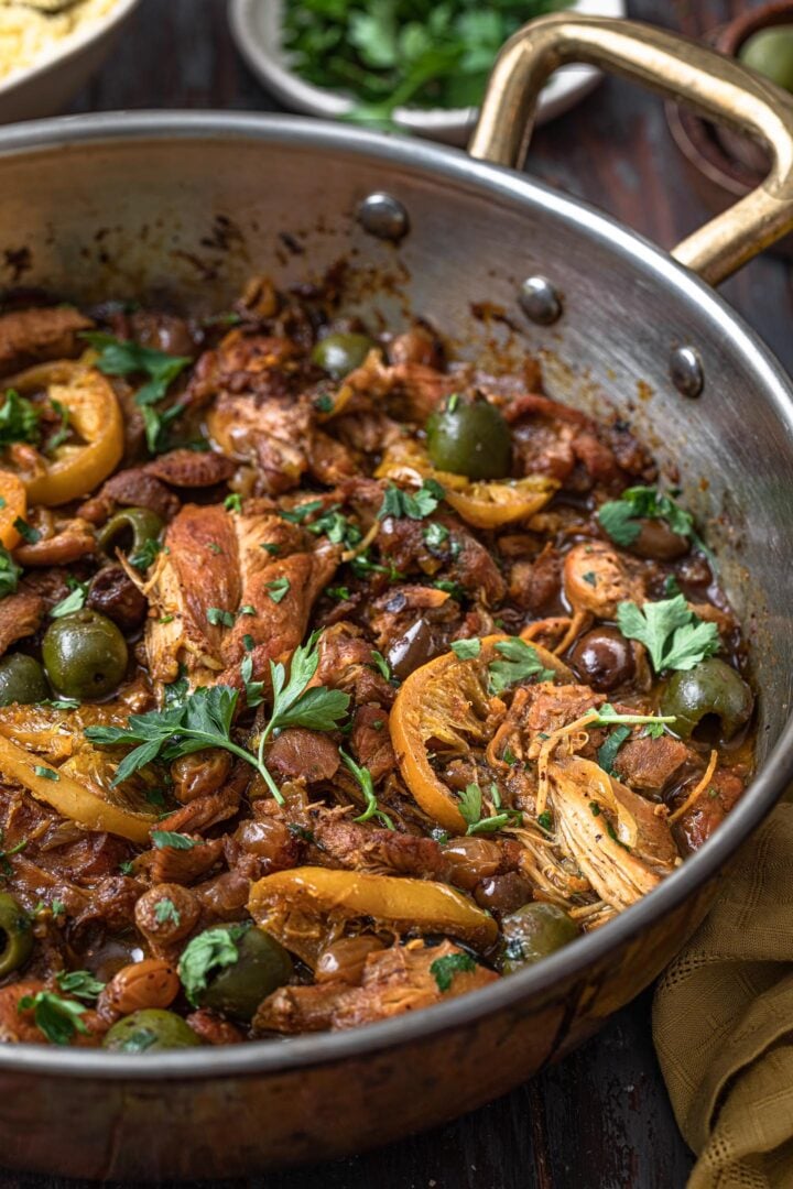 A close up shot of a pan of chicken tagine.