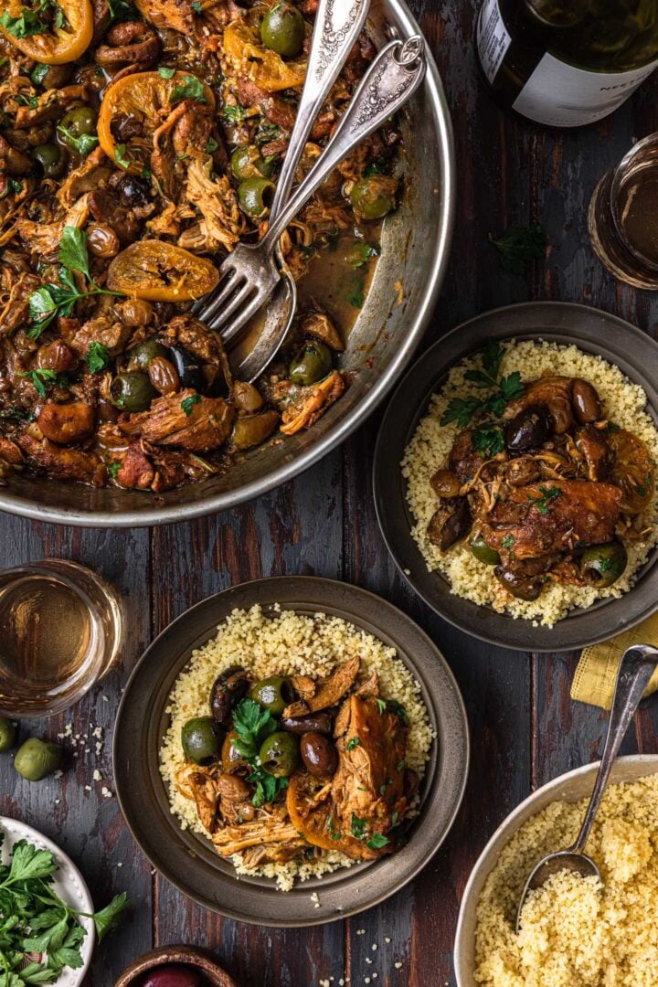 Serving chicken tagine. A pan with the chicken tagine and two individual portions served over couscous.