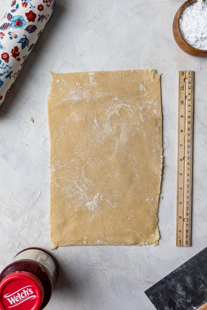 Rolling pie dough to make toaster pastries.