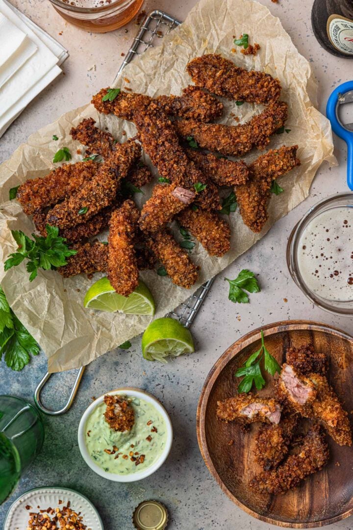 A serving scene. Idaho finger steaks served with beer and chimichurri mayo.