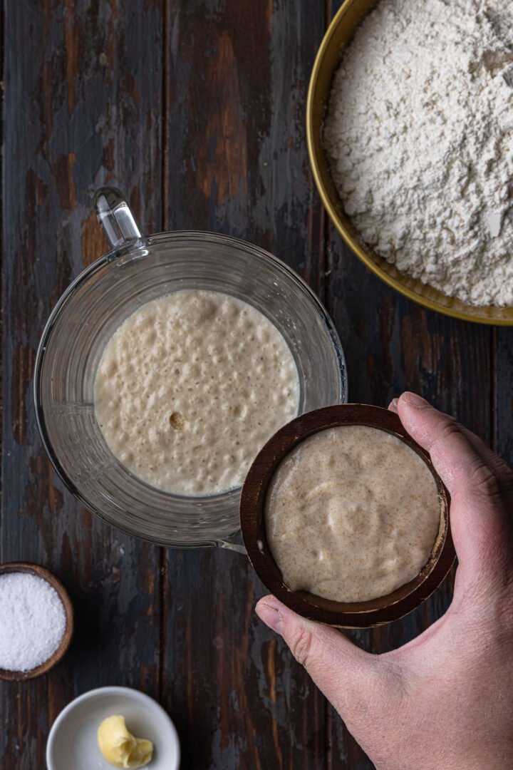 Optional: adding sourdough starter to the yeast mixture.