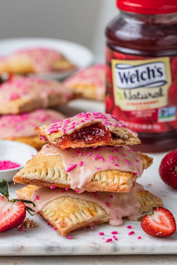 3 toaster pastries stacked. You can see the strawberry filling of the top one.