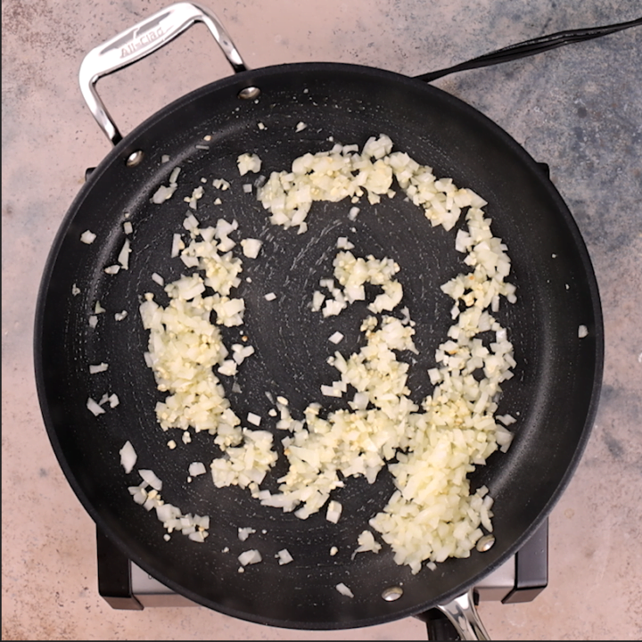 Sautéing the onions for the burrito filling.