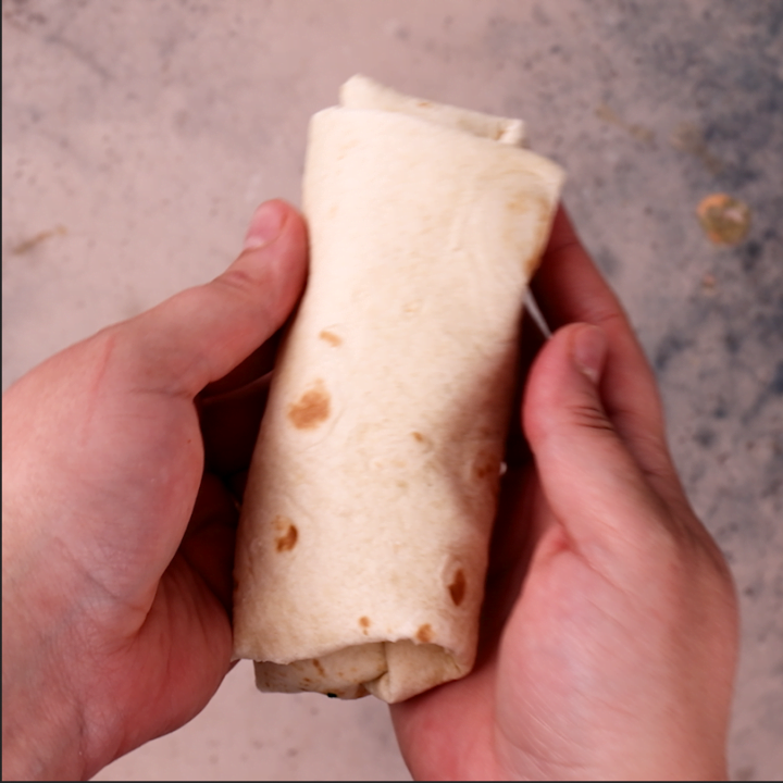 A rolled beef burrito.