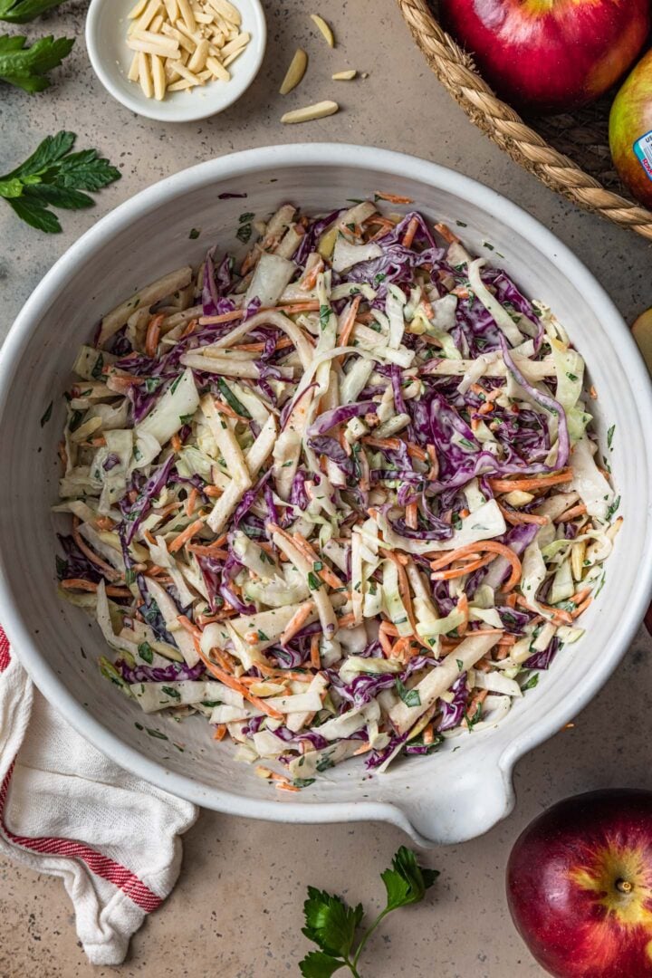 Apple slaw in a white bowl. 