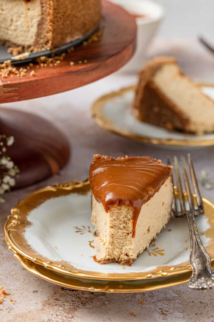 A cut slice of dulce de leche cheesecake to show the creaminess.
