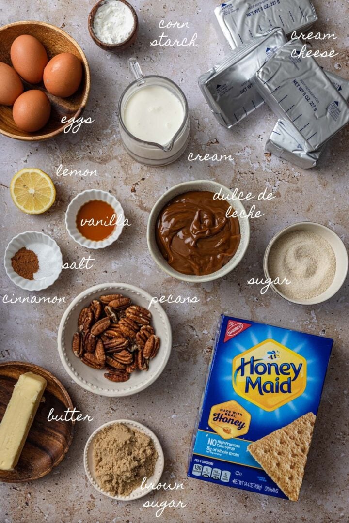 A photo of all the ingredients needed to make dulce de leche cheesecake.