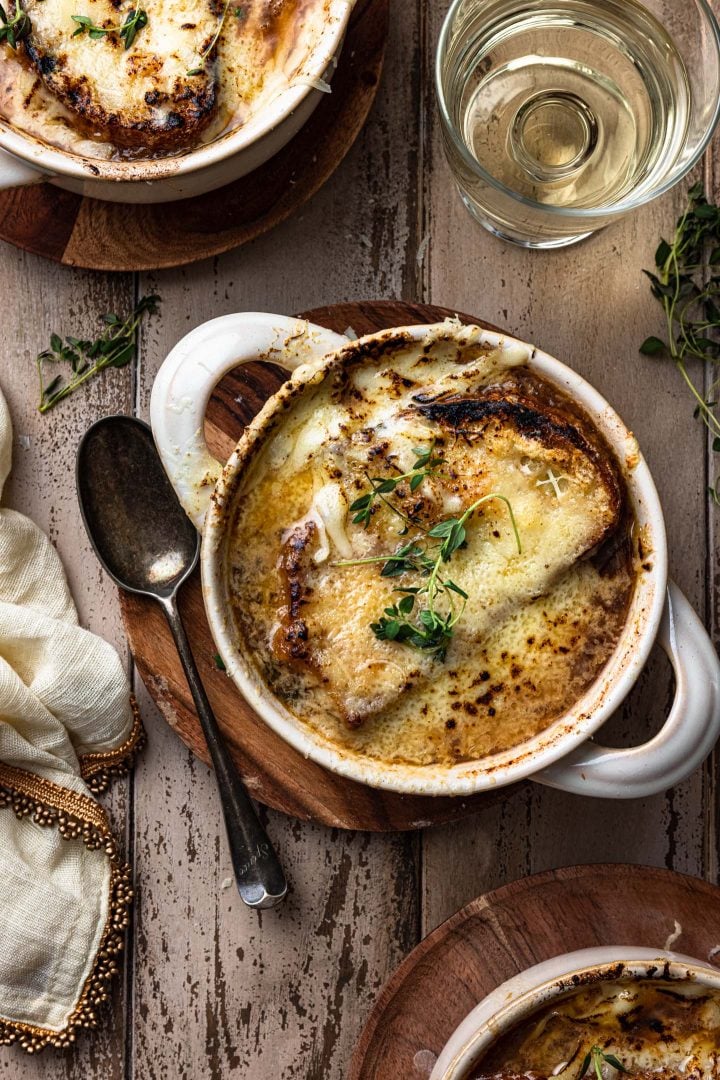 An overhead photo of a cheesy bowl of this French onion soup recipe.